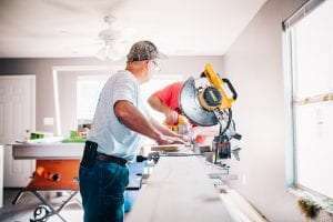 Two men remodeling a house