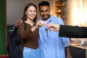 front-view-couple-receiving-keys