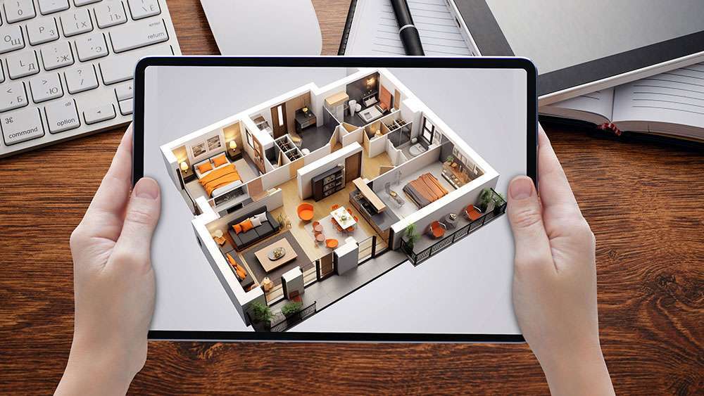 Hands holding tablet computer with augmented reality image of a home's interior layout